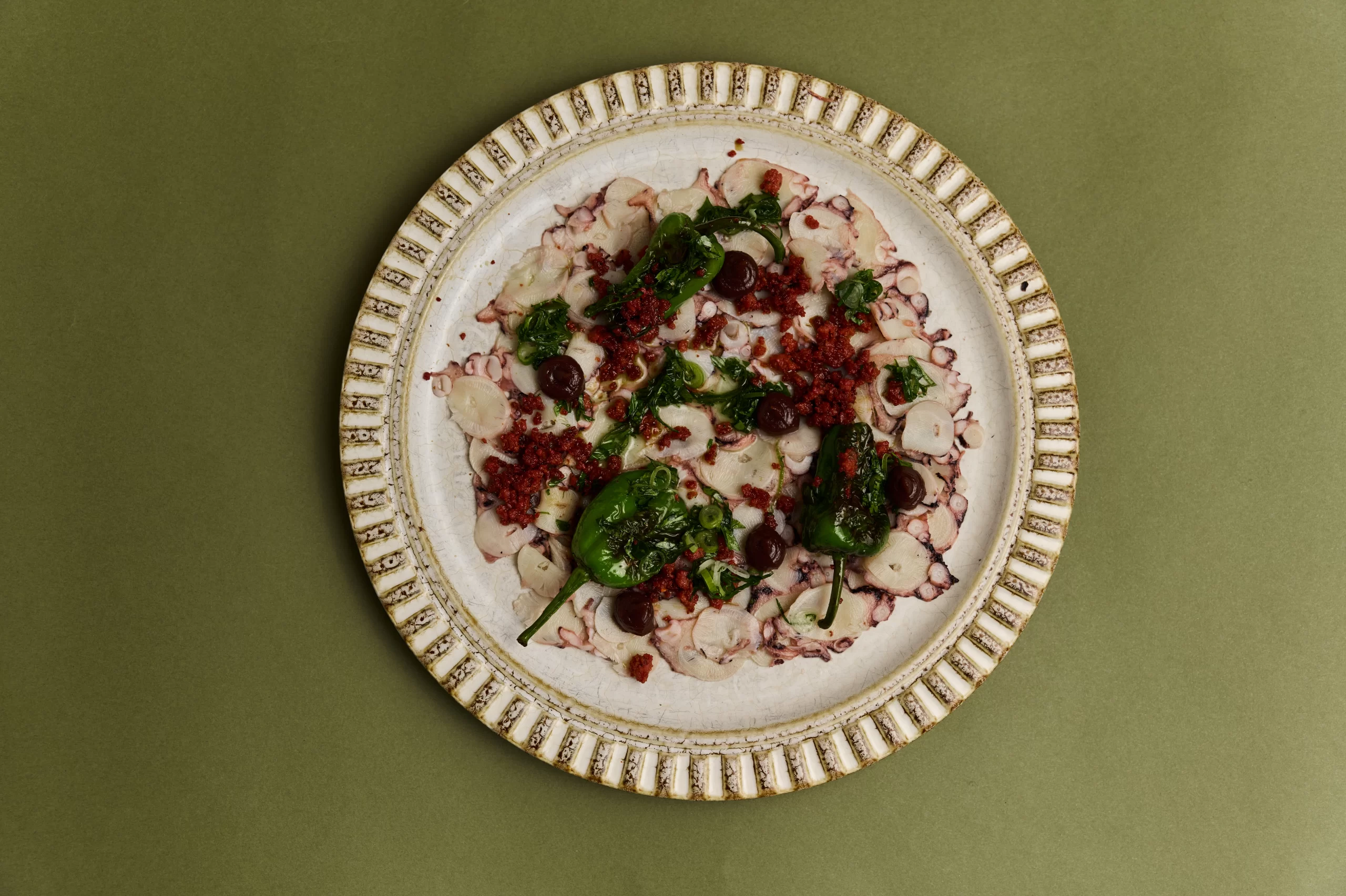 Octopus Carpaccio, Charred Padron Peppers, Sujuk, Spring Onion Salsa